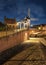 Historical harbor with windmill, drawbridge and mansions at night, Heusden