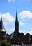 Historical Holsten Gate and Cathedral in Spring in the Old Town of the Hanse City of Luebeck, Schleswig - Holstein