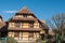 Historical house in alsatian village on blue sky background