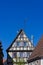 historical house facades and rooftops on blue sky