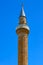 The historical Iplikci Mosque minaret, the against the blue sky on a beautiful day in Aksehir.