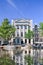 Historical mansion reflected in a canal, Amsterdam, Netherlands.