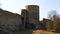 Historical monument. View of the stone walls and towers of the ancient fortress of Koporye. Russia.