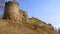 Historical monument. View of the stone walls and towers of the ancient fortress of Koporye. Russia.