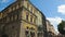 Historical museum facade building in summer Lviv, people viewing architecture