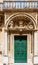 Historical ornate wooden green door in a stone entry in Mdina, Malta