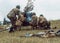 Historical reconstruction second world war. Soldiers on the battlefield, cannon.