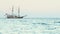 Historical sail ship in sea. Beautiful frigate drifting in ocean. Old tall ship