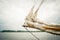 Historical sailship jib boom with wrapped sails