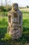 Historical Scythian monuments called kurgan stelae standing in nature against blue sky with clouds at golden house