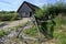 Historical shipbuilding rack and house with thatched roof in the reconstructed Viking village Hedeby on the inlet Schlei of the