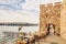 Historical southern walls and tower gate over the Black sea cove in Sozopol, Bulgaria, Europe at dusk.