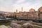 Historical Taslihan ruins with the old watch tower and minaret of Gazi Husrev mosque at