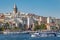 Historical tower and mosque in centre istanbul seashore with boats and tower turkey