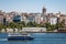 Historical tower and mosque in centre istanbul seashore with boats and tower turkey