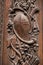 Historical wooden gate of Frauenkirche with rich carving ornaments, Munich, Germany