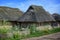 Historical wooden house with thatched roof in the reconstructed Viking village Haithabu on the banks of the inlet Schlei of the