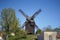 Historical wooden windmill against blue sky in Werder, Brandenburg, Germany