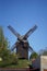 Historical wooden windmill against blue sky in Werder, Brandenburg, Germany