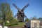 Historical wooden windmill against blue sky in Werder, Brandenburg, Germany