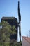 Historical wooden windmill against blue sky in Werder, Brandenburg, Germany
