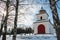 Historical yellow and white chapel with wooden cupola