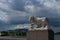 History and modernity - a white lion statue and a modern stadium that looks like a flying saucer. St. Petersburg