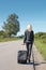 Hitchhiker walking along a rural road