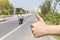 Hitchhikers sign thumb up