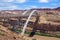 Hite crossing steel bridge across canyon of Colorado River in Utah, USA. Classic arch of a bridge in the American desert