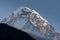 Hiunchuli snowcapped mountain summit against blue sky in Annapurna Base Camp trekking