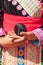 Hmong girl holding weave cotton rope ball.