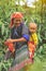 Hmong tribe oman carrying her child in her backpack in Vietnam