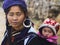 Hmong Woman Carrying Child and Wearing Traditional Attire, Sapa, Vietnam