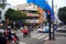 Ho Chi Minh city, Vietnam - December 2018: buildings with signboards on the crossroad with traffic, motorbikes and cars