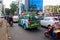 Ho Chi Minh city, Vietnam - December 2018: green taxi in traffic jam on the crossroad with motorbikes and cars at evening.