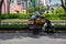 Ho Chi Minh, Vietnam - 30 Jul 2019: Poor man with garbage cart on city street. Paper waste recycle