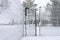 Hoarfrost covered metal fence with open door