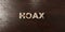 Hoax - grungy wooden headline on Maple - 3D rendered royalty free stock image