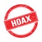 HOAX text on red grungy round stamp