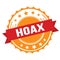 HOAX text on red orange ribbon stamp