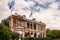 Hobart, Tasmania, Australia - December 13, 2009: Brown-stone historic mansion, now famous Alexander Restaurant under blue sky with