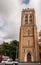 Hobart, Tasmania, Australia - December 14, 2009: closeup and frontal view on brown stone tower of Saint Davids Cathedral. Street