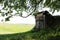 Hobbit house barn in green forest lawn