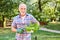 Hobby gardener with a basket of basil