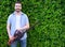 Hobbyist gardner using an hedge clipper in the home garden