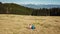 Hochanger - Hiker couple on golden alpine meadow of mount Hochanger, Bruck an der Mur, Lavanttal Alps, Styria, Austria