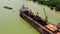 HOCHIMINH, VIETNAM - APRIL, 2020: Aerial panorama view of the tanker on Saigon river moored in the port of Hochiminh.