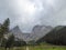 Hochkogel - An idyllic narrow pathway leading to the Alpine Valley in the region of Eisenerz, Austria. There are thick clouds