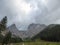 Hochkogel - An idyllic narrow pathway leading to the Alpine Valley in the region of Eisenerz, Austria. There are thick clouds